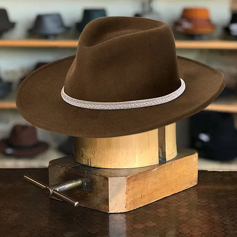 Brown Triangular Crown Hat with Curved Wavy Brim and White Leather Hatband